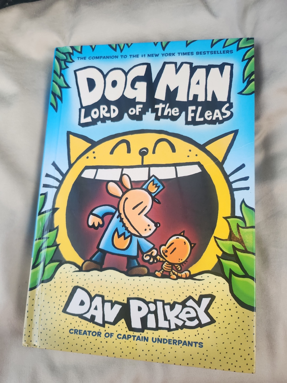Scholastic Dog Man Cover in Blue, Yellow and Green